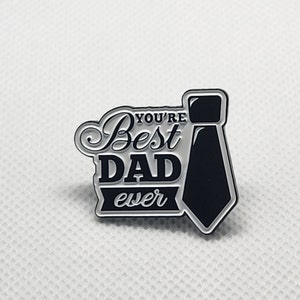 May include: A black and white enamel pin with a tie design and the text "You're Best Dad ever".