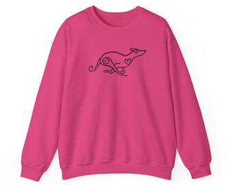May include: A bright pink sweatshirt featuring a black line drawing of a running dog with a heart detail. The dog design is stylized with swirls and curves. The sweatshirt has long sleeves and a crew neck.