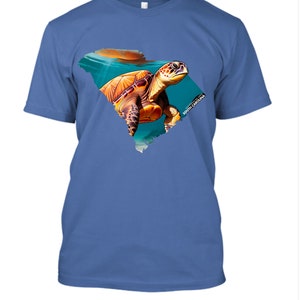 May include: A blue t-shirt with a graphic of a sea turtle swimming in the outline of the state of South Carolina. The text "South Carolina" is printed on the graphic.