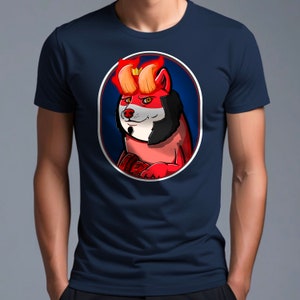 May include: A navy blue t-shirt with a graphic of a red and black dog with a crown and horns. The dog is surrounded by a white oval with a blue background.