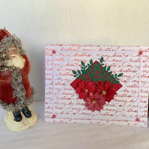 Vrolijke kerstkaart.  Gestanste kerstkaart met groen en verhoogde kerststerren. 5" x 7" - blanco binnenkant en geleverd met envelop.
