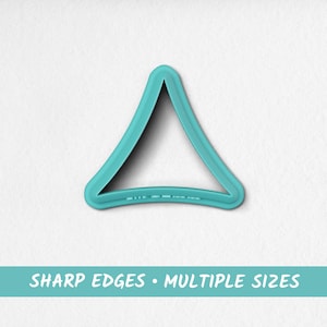 May include: A turquoise blue triangle-shaped cookie cutter with sharp edges. The cookie cutter is on a white background. SHARP EDGES - MULTIPLE SIZES - Printeo