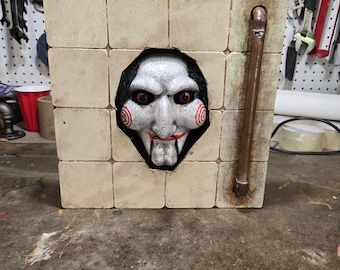 Billy puppet from saw wall display