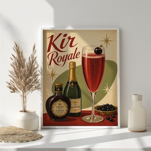 May include: A framed print depicting a Kir Royale cocktail. The image shows a champagne flute with a red drink, a bottle of champagne, a bottle of Crème de Cassis, and a small bowl of dark berries. The words "Kir Royale" are in a decorative font.