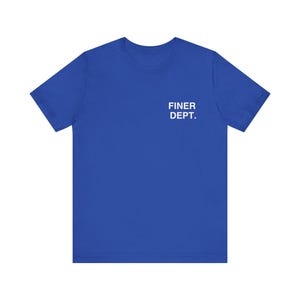 May include: Royal blue t-shirt with the text "FINER DEPT." printed in white on the upper left chest area. The shirt has short sleeves and a crew neck.