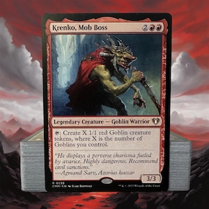 May include: A Krenko, Mob Boss trading card featuring a green-skinned goblin warrior in a red cloak holding a blade. The card text includes the name, mana cost, creature type, ability text, flavor text, and a 3/3 power and toughness rating.