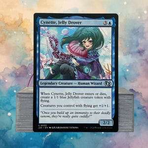 May include: A Magic: The Gathering card featuring "Cynette, Jelly Drover." The card has a blue border and depicts an anime-style character with green hair and a jellyfish. Text includes "Legendary Creature - Human Wizard" and game instructions. The card's power and toughness are 2/2.