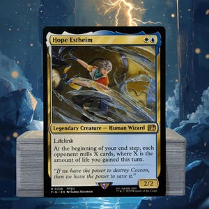 May include: A Magic: The Gathering card featuring "Hope Estheim," a Legendary Creature Human Wizard. The card has a gold border with blue and black accents. The artwork depicts a character in action with text describing its abilities and flavor text.