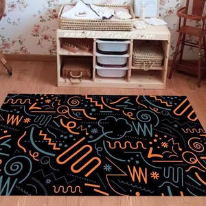 Playful Abstract Lines Kids&#39; Room Rug – Black Background with Orange & Blue Doodle Shapes – Fun Modern Carpet for Playroom or Bedroom