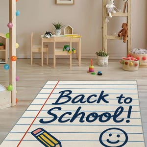 Thin lightweight rug with back-to-school theme, styled in a kid’s bedroom with colorful furniture.