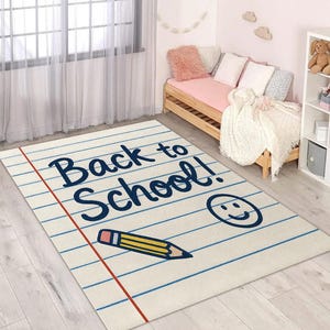 Educational kids’ rug featuring “Back to School” text with doodle-style pencil and smile illustration.