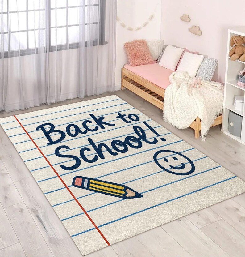 Educational kids’ rug featuring “Back to School” text with doodle-style pencil and smile illustration.