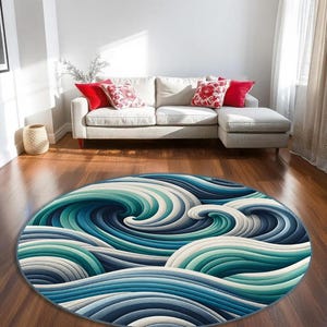 May include: A round rug with a blue, green, and white wave pattern. The rug is made of soft, plush material and is perfect for adding a touch of coastal style to any room.