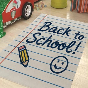 Back to School rug designed like a notebook page with lined paper, pencil graphic, and smiley face.