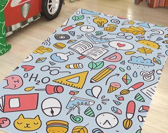 May include: A light blue rug with a repeating pattern of school-themed doodles. The design includes pencils, books, lightbulbs, hearts, and other colorful illustrations. The rug is rectangular and appears to be made of a soft material.