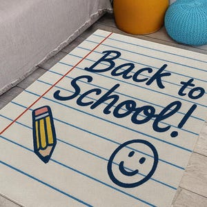 White rug with blue and red notebook lines, “Back to School” text, and doodle graphics.