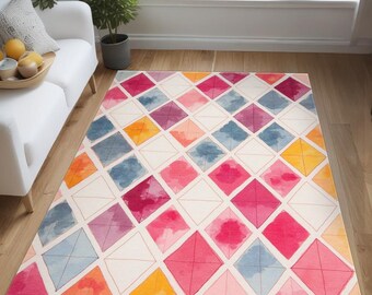 May include: A colorful area rug with a geometric pattern of pink, yellow, blue, and orange watercolor diamonds on a white background.