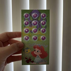 May include: A green card featuring a cartoon octopus and bubbles with numbers. Below, a cartoon mermaid and crab are depicted. The text "Part of your World" and "SAVES 65" are also visible on the card.