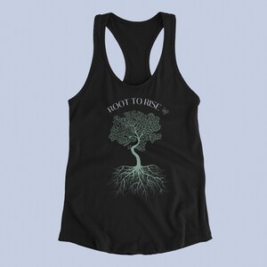May include: Black racerback tank top with a green tree and roots graphic and the text "ROOT TO RISE".