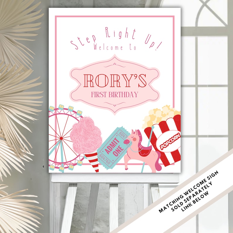 May include: A pink and white welcome sign for a carnival themed first birthday party. The sign says "Step Right Up! Welcome to Rory's First Birthday". The sign features a Ferris wheel, cotton candy, popcorn, a ticket, and a carousel horse.
