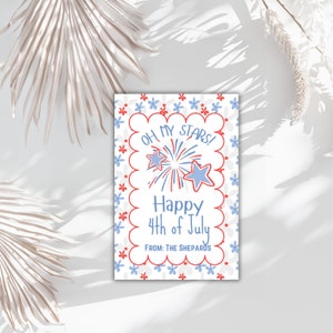 May include: A white card with red and blue stars and fireworks. The card says "Oh My Stars! Happy 4th of July. From: The Shepards".