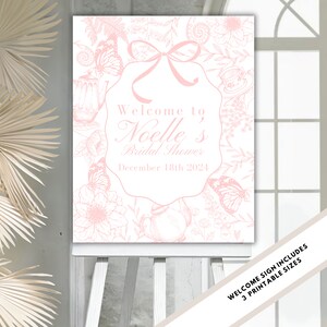Puede incluir: Un cartel de bienvenida rosa con un diseño floral y el texto "Bienvenido al Bridal Shower de Noelle December 18th 2024".