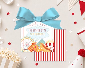 May include: A birthday party favor tag with a light blue bow. The tag has a red and white striped background and features carnival-themed illustrations, including a Ferris wheel, hot dog, and popcorn. Text reads "Thank You! Henry's 5th Birthday."