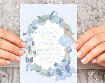 May include: A blue and white invitation for a Nutcracker Tea Party in honor of Everly's 6th birthday. The invitation features a ballerina and a Nutcracker doll in front of a wreath with blue ribbons. The text on the invitation reads "Join us for a Nutcracker Tea Party in honor of Everly's 6th Birthday, December 18th at 3pm, 1234 Teapot Trail, Yourtown State Zip."