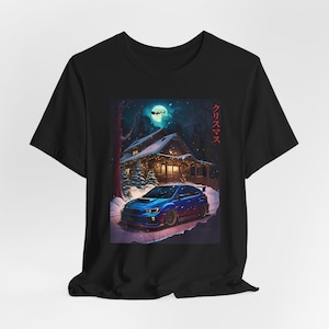 May include: A black t-shirt with a blue Subaru WRX STI car in a snowy winter scene with a cabin in the background. The text "クリスマス" is printed on the right side of the image.