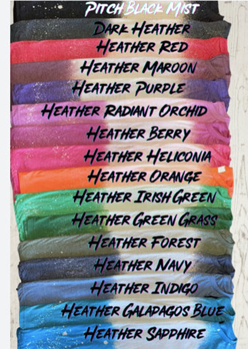 May include: A stack of fabric swatches in various shades of heather, including pitch black mist, dark heather, heather red, heather maroon, heather purple, heather radiant orchid, heather berry, heather heliconia, heather orange, heather irish green, heather green grass, heather forest, heather navy, heather indigo, heather galapagos blue, and heather sapphire.