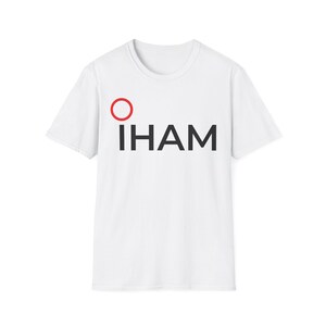 May include: White t-shirt with a red circle and the word "IHAM" printed in black.