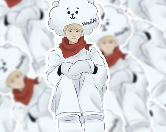 May include: A cartoon illustration of a person wearing a white winter outfit with a red scarf and a white cloud-shaped hat with the text "SARANJIME" on it. The person is sitting with their arms crossed and wearing white mittens.