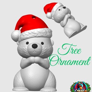 May include: White ceramic Christmas tree ornament shaped like a bear wearing a red Santa hat. The bear has its paws clasped in front of it. The ornament has a hole at the top for hanging.