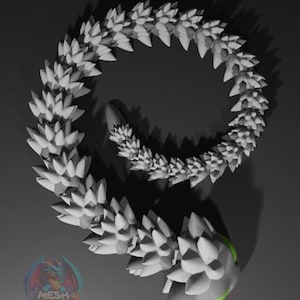 May include: A white, spiky, 3D printed dragon tail, curled into a circle. The tail is made of many small, pointed scales. The tail is a light gray color with a green highlight on the end.
