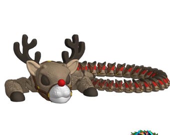 May include: A brown and red reindeer with a long segmented tail. The reindeer has a red nose and a brown leather harness. The reindeer is lying down with its head turned to the side.