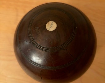 Antique Turned Wood Bocce Ball. Good Condition, minimal ware, 2 small cracks, Ivory dots on either end, and a "T" "Bias" 3 and 5 engraving.