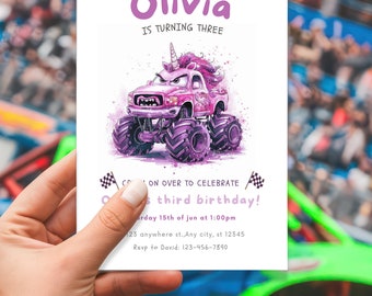 May include: A pink and purple monster truck with a unicorn horn and a grumpy face. The truck is on a white background with a checkered flag on each side. The text "Olivia is turning three" is at the top of the card. The text "Come on over to celebrate Olivia's third birthday!" is in the middle of the card. The text "Saturday 15th of June at 1:00pm" is below the text. The text "123 anywhere st., Any city, st 12345" is below the text. The text "RSVP to David: 123-456-7890" is at the bottom of the card.
