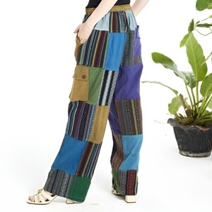 May include: Patchwork pants with a variety of colors and patterns, including blue, green, brown, and purple. The pants have a wide leg and a relaxed fit.
