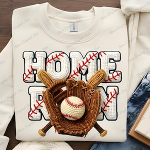 May include: Cream-colored sweatshirt with a baseball-themed design. The words "HOME RUN" are displayed in white, with red stitching accents. A baseball, mitt, and bats are featured in the design.