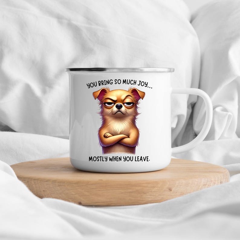 May include: White enamel mug with a cartoon dog with a grumpy expression. The mug has the text "You bring so much joy... Mostly when you leave."