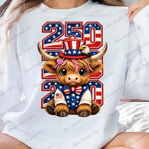 May include: White sweatshirt featuring a cartoon Highland cow dressed in patriotic attire. The cow wears a top hat, bow tie, and jacket with American flag details. The numbers "250 2020" are displayed in a red, white, and blue design.