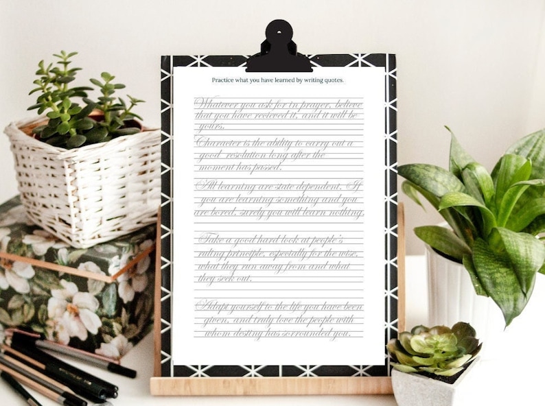 May include: A white sheet of paper with black lines on it. The paper is on a clipboard with a black and white patterned design. The paper has several quotes written on it in cursive handwriting. The quotes are about character, learning, and taking a good hard look at people. The text on the paper reads: "Practice what you have learned by writing quotes. Whatever you ask for to prayer, believe that you have received it, and it will be yours. Character is the ability to carry out a good resolution long after the moment has passed. All learning are state dependent. If you are learning something and you are bored, surely you will learn nothing. Take a good hard look at people's ruling principles, especially for the wise, what they run away from and what they seek out. Adapt yourself to the life you have been given, and truly love the people with whom destiny has surrounded you."