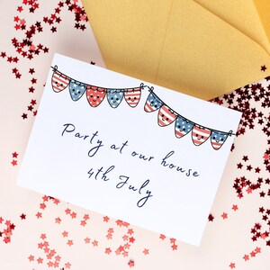 May include: A white card with blue and red text that says "Party at our house 4th July". The card has a string of red, white, and blue bunting with stars and smiling faces.