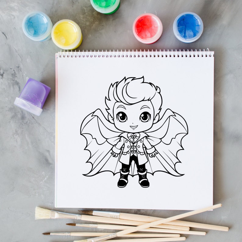 May include: A black and white line drawing of a cartoon vampire boy with wings on a white sheet of paper. There are paint pots and paint brushes on a gray surface.