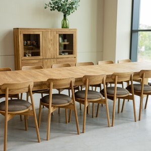 The BALDER dining tableos made from  solid oak wood. With extraordinary dimensions, reaching five meters in length, it has 4 extensions that are attached to the inside of the table top and 2 that can be attached at the ends.