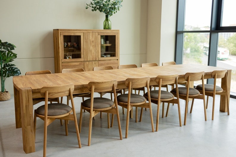 The BALDER dining tableos made from  solid oak wood. With extraordinary dimensions, reaching five meters in length, it has 4 extensions that are attached to the inside of the table top and 2 that can be attached at the ends.