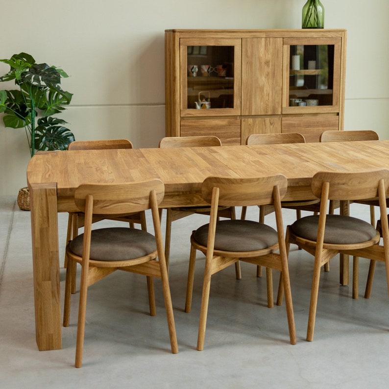 The BALDER dining tableos made from  solid oak wood. With extraordinary dimensions, reaching five meters in length, it has 4 extensions that are attached to the inside of the table top and 2 that can be attached at the ends.