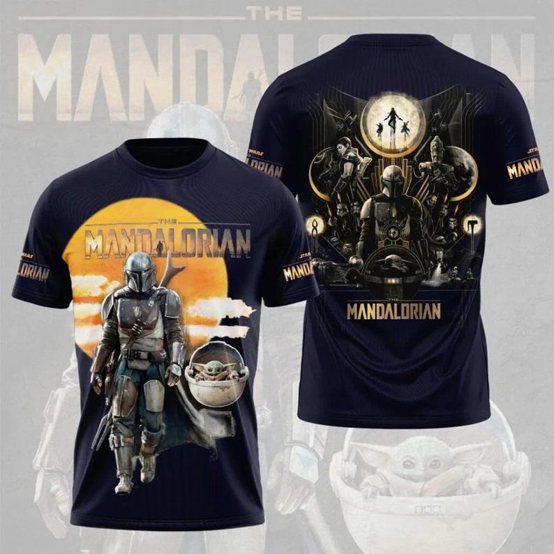 May include: Navy blue t-shirt featuring a graphic of The Mandalorian and Grogu against a sunset backdrop. The front of the shirt displays the Mandalorian in armor, while the back showcases a detailed scene with characters and the text "Mandalorian".