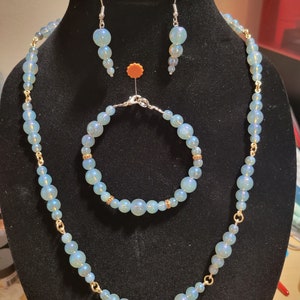 Blue pearlescent necklace, bracelet and earrings