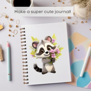 May include: Spiral-bound journal with a cartoon raccoon holding a bouquet of pink flowers. The raccoon has gray and white fur with a black striped tail. The journal cover has the text "Make a super cute journal!"
